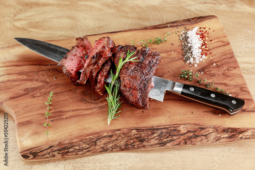 Foto Meat of beef impaled on a knife