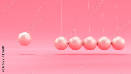 Obraz na płótnie pink newton cradle in motion.