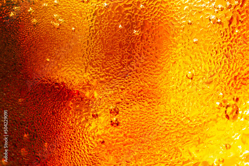 macro cola texture,cola with ice food background, cola close-up, design element. beer macro bubbles, ice, bubble, background, ice cubes, abstract backgrounds