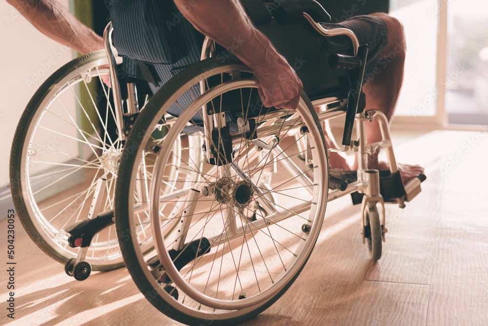 Wheelchair of person with disability in the house or hospital with nature sunlight, Cinematic tone and emotion picture, Life Insurance accident, International Day of Persons with Disabilities concept. Wheelchair of person with disability in the house or hospital with nature sunlight, Cinematic tone and emotion picture, Life Insurance accident, International Day of Persons with Disabilities concept.