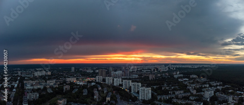 Epic aerial vivid sunset panorama view above residential district. 23 serpnia Pavlovo Pole, Kharkiv city, Ukraine. Majestic evening and summer streets