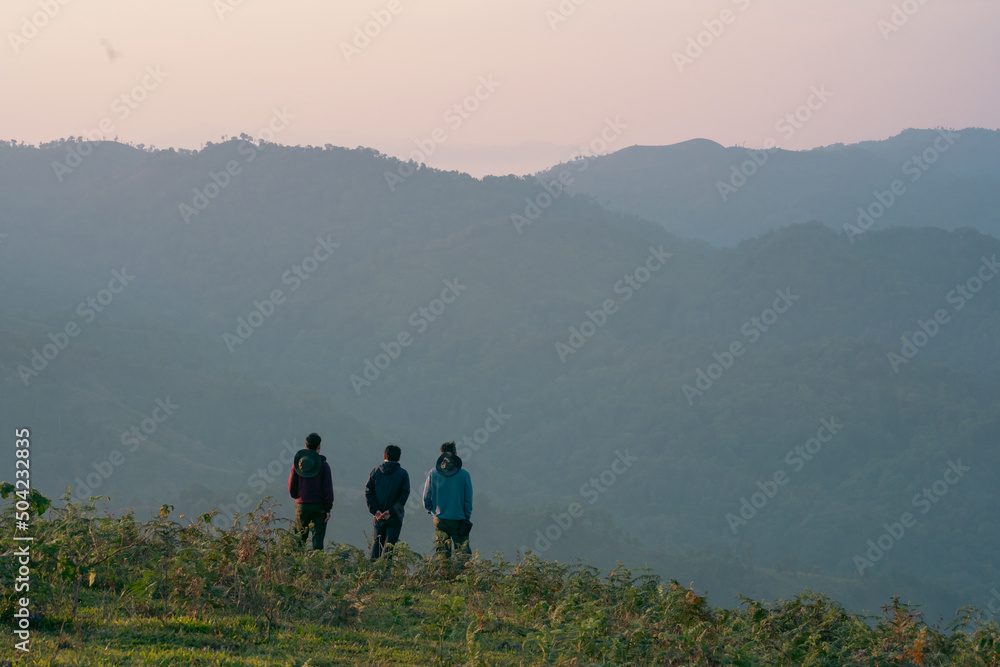 group of hiker man relax with wellbeing and happy feeling on top of mountain group of hiker man relax with wellbeing and happy feeling on top of mountain