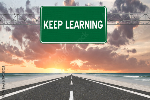 Keep Learning text on highway sign.