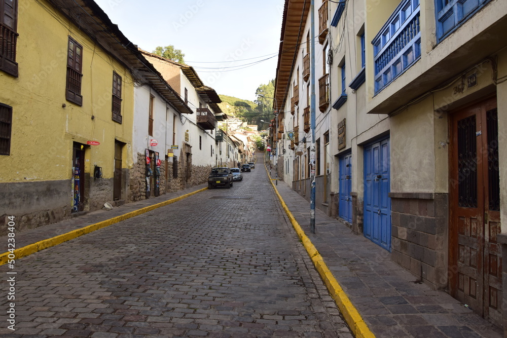 Cusco street with beautiful ancient architecture. Cobbled street of the old city of Cusco