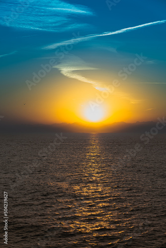 On the horizon is the sun sky sea clouds bird © Anastasia