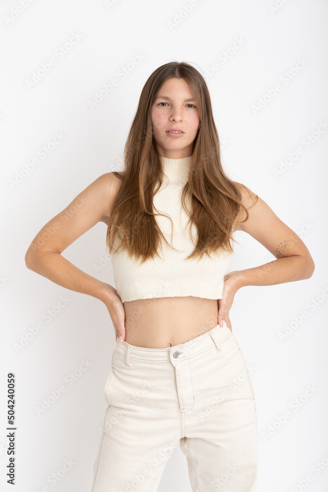 Young Woman dressing white on photo studio shooting - Confidence Young Woman dressing white on photo studio shooting - Confidence