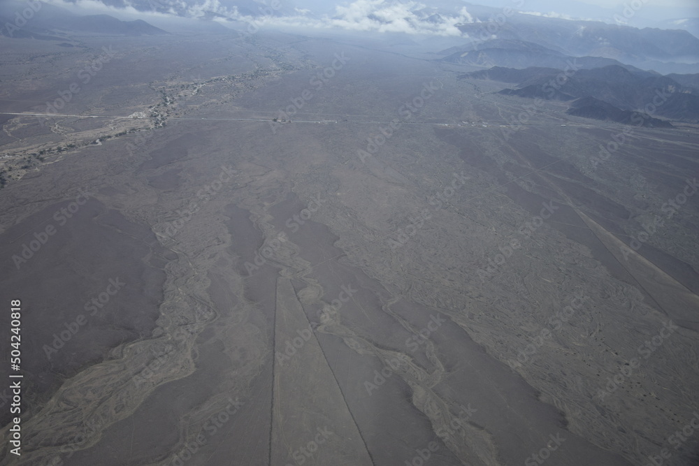 Mysterious figures Nazca desert from the aircraft. Nazca plateau, Peru