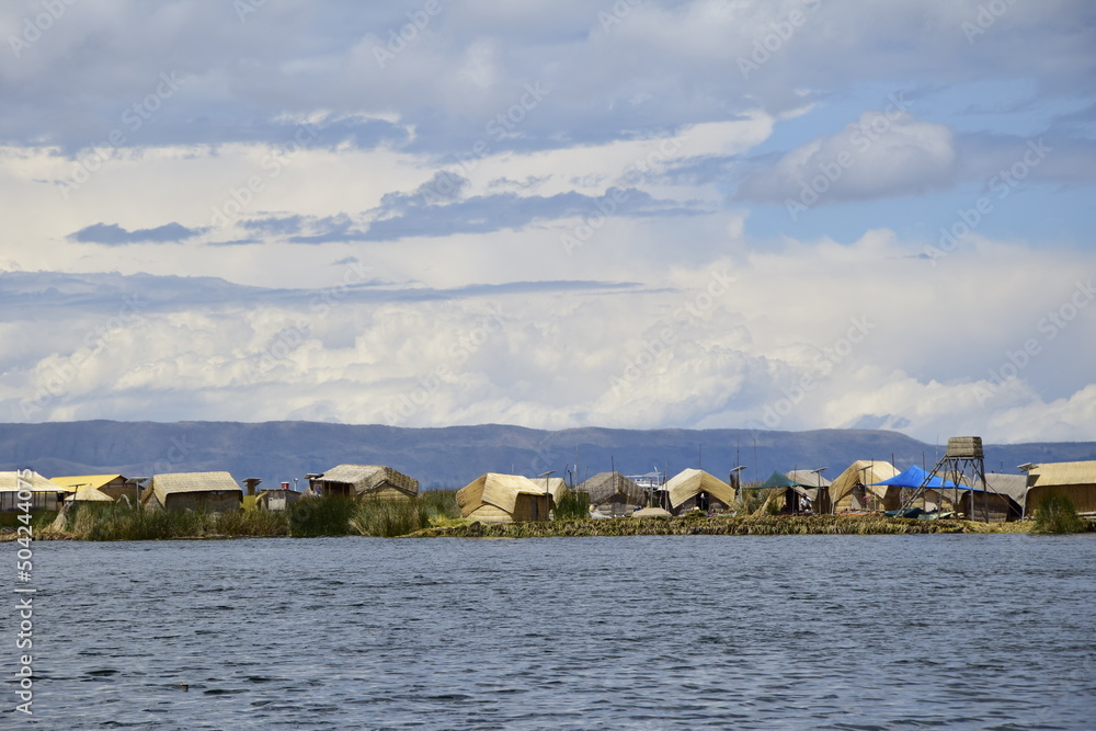 Floating islands near Puno city, Buildings and houses made of straw on the floating islands of Lake Titicaca. Puno, Peru