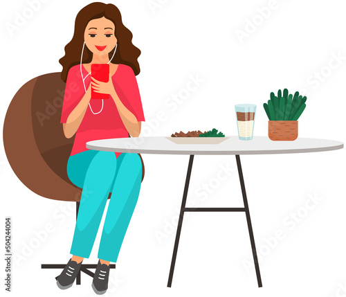 Woman sitting holds smartphone in her hand. Casual lady in headpones listening to music and browsing social media on mobile device. Girl on couch uses phone for chatting and surfing internet