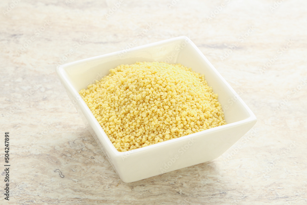 Raw couscous in the bowl