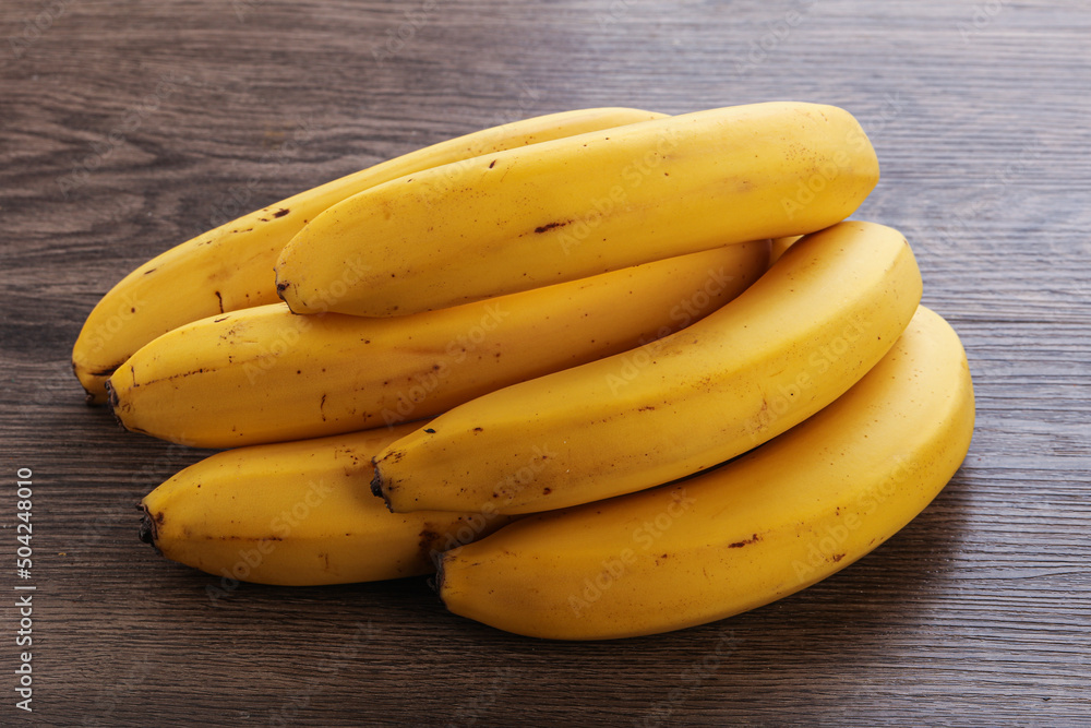 Tropical yellow banana fruit heap Tropical yellow banana fruit heap