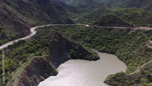 panoramic view of the Caucasus mountains gorges ancient fortresses and curved mountain roads on a spring day