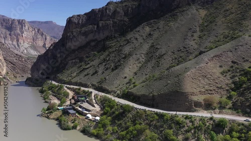 panoramic view of the Caucasus mountains gorges ancient fortresses and curved mountain roads on a spring day