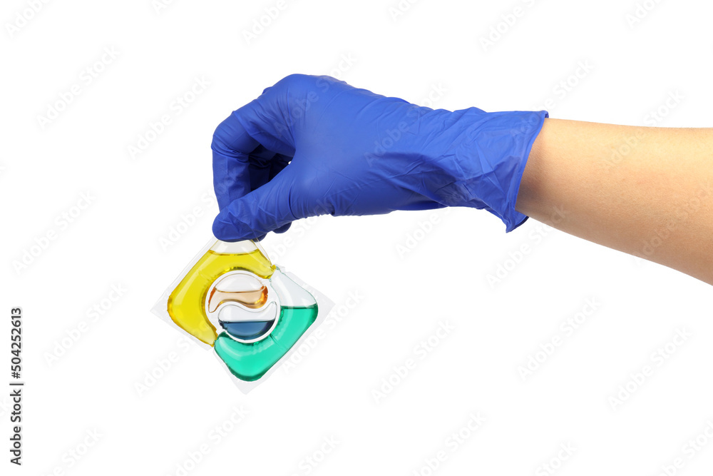 hand in a glove holds a capsule of washing powder isolated on a white background hand in a glove holds a capsule of washing powder isolated on a white background
