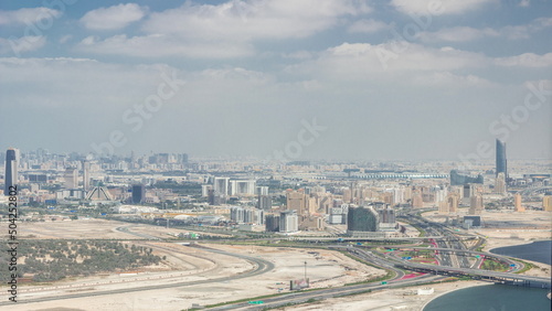 Panoramic skyline of the Dubai city with modern skyscrapers in Deira and Zabeel district aerial timelapse