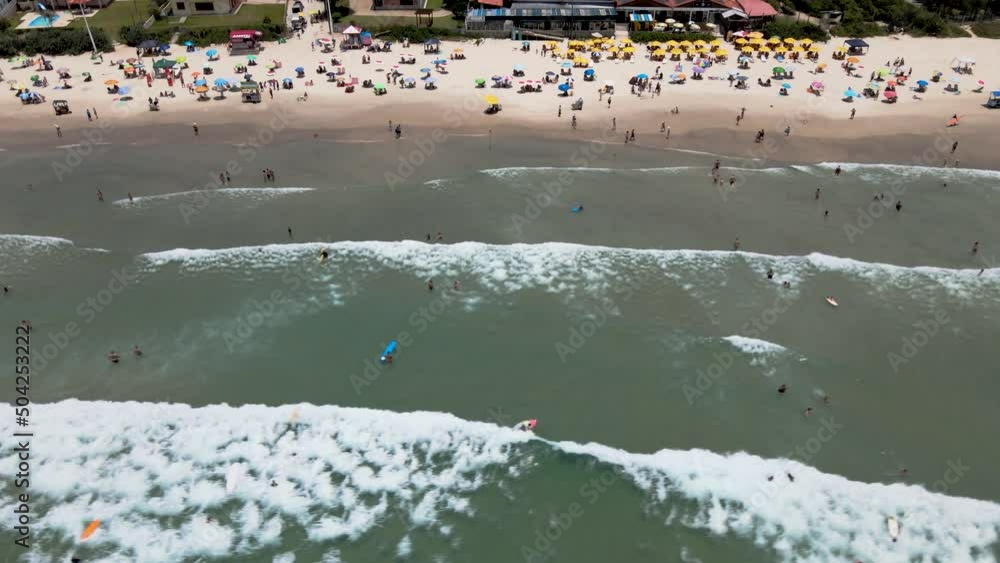 aerial drone image of beautiful tropical beach seen from above with people, tourists enjoying sunbathing doing sports, diving, surfing with leisure at tourist spot in high season crowded beach many aerial drone image of beautiful tropical beach seen from above with people, tourists enjoying sunbathing doing sports, diving, surfing with leisure at tourist spot in high season crowded beach many