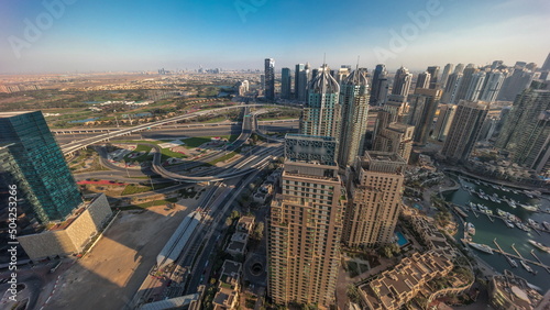 Dubai marina and JLT skyscrapers along Sheikh Zayed Road aerial timelapse.