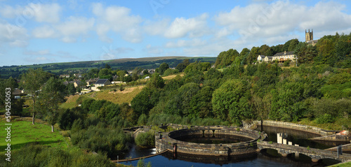 Old Water works and river Etherow at Hadfield Derbyshire with village of Tintwistle in background.