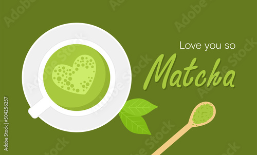 Japanese green matcha tea with heart-shaped foam in a cup, decorated by leaves, powder in a bamboo spoon on a green background. Top view