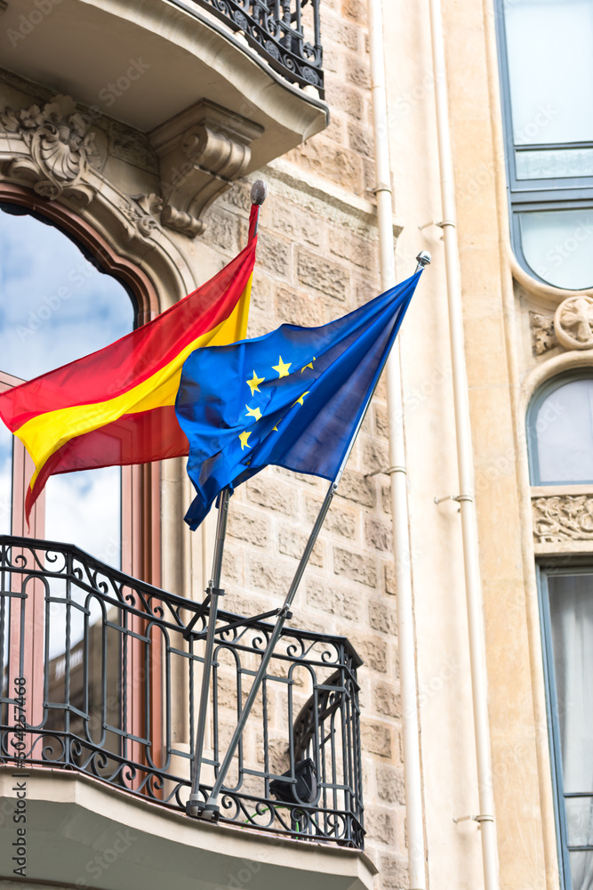 Flags of Spain and United Europe on balcony