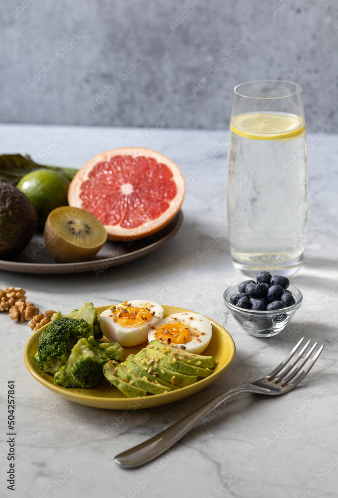 Healthy breakfast to improve metabolism with boiled eggs, vegetables, fruits, seeds and nuts. Healthy breakfast to improve metabolism with boiled eggs, vegetables, fruits, seeds and nuts.