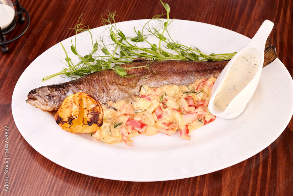 grilled fish with vegetables and microgrens