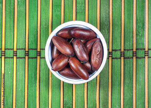 baru nut or cumaru in the bowl on the table. The baru or cumaru is a tree native to Brazil.