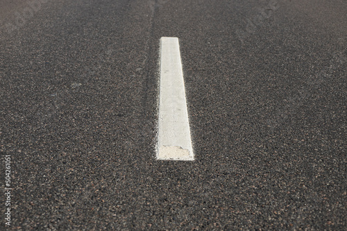 Asphalt road with single solid white line road marking