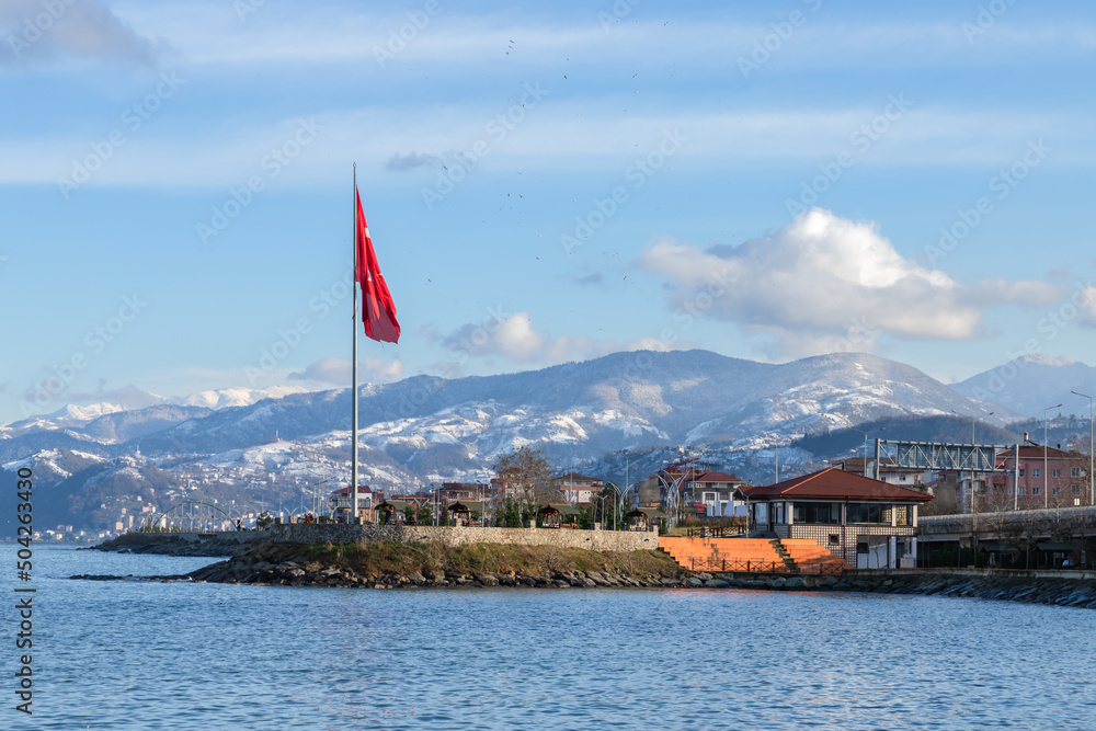 Coastal view with Turkish flag of Arakli, Trabzon, Turkey