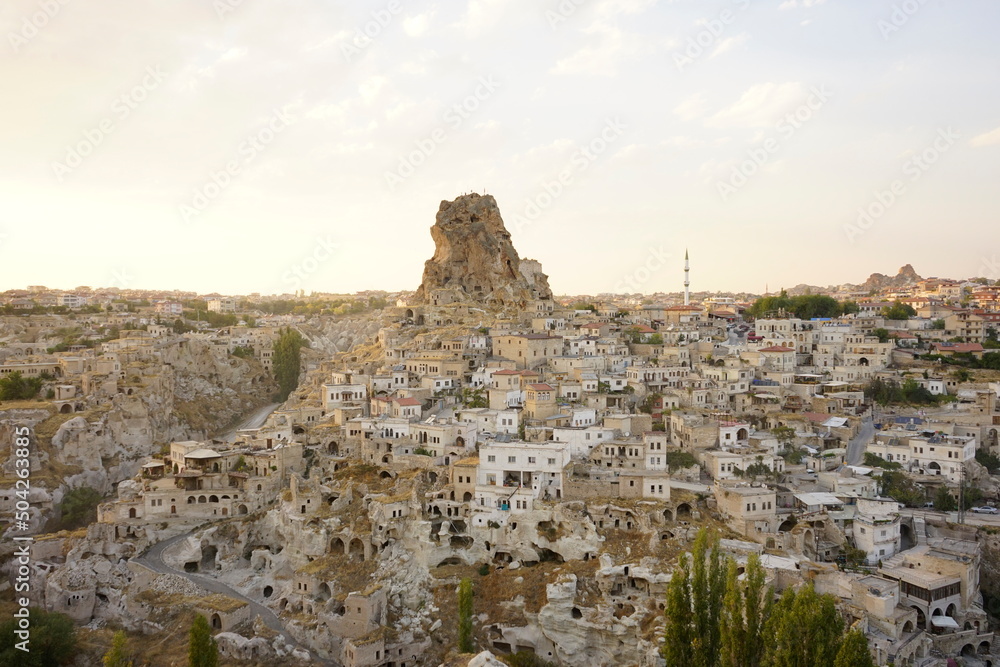 View of Ortahisar town old houses in rock formations from Ortahisar Castle. Cappadocia. Nevsehir Province. Turkey