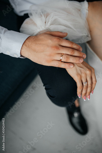 hands of a guy and a girl, a ring on their hands