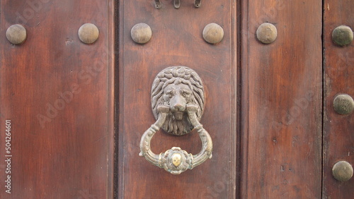 Vintage brass door knocker on an old door, Cuba, Havana