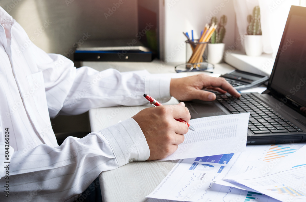 Finance and business concept. Business man working with laptop and documents. Mobile technologies, internet, vintage color, selective focus. Finance and business concept. Business man working with laptop and documents. Mobile technologies, internet, vintage color, selective focus.