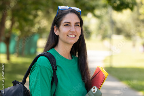 Fototapeta student girl with books outdoors