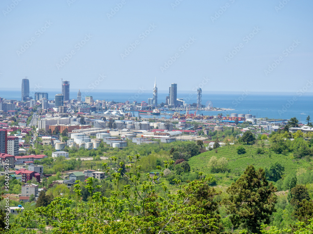 View from the mountain to the modern city. Beautiful cityscape.  from above. City by the sea