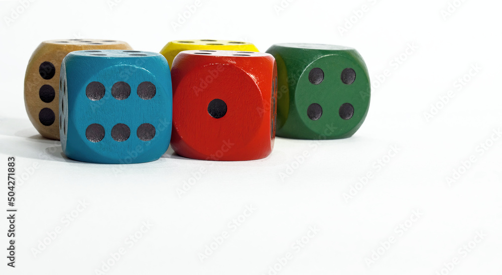 Colored dice on white background. Copy space.