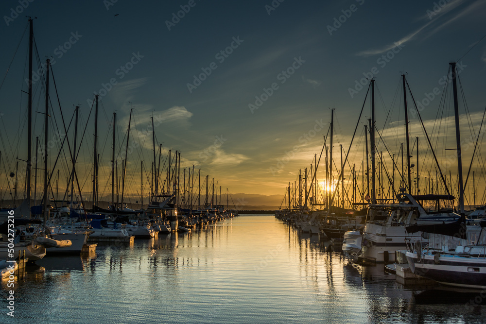 Sunset over ships moored at Shilshole Bay Marina, Ballard, Seattle, Washington