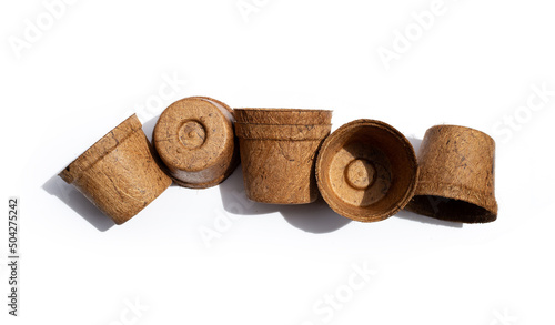 Coco coir pots on white background.