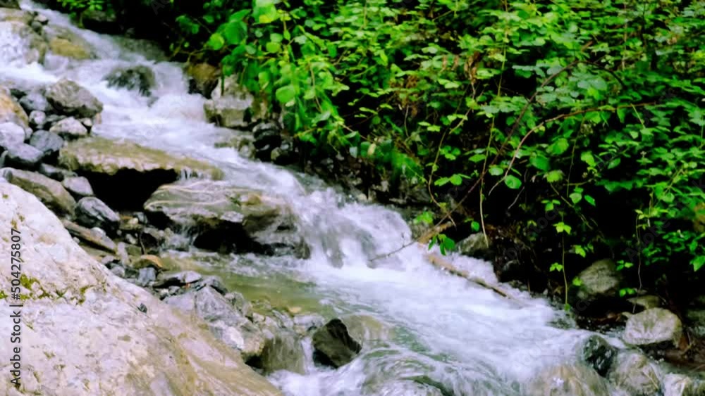 waterfall giessbach in alpine mountains, fast flowing powerful stream of clear water, splashes scatter, concept of wild nature, symbol of natural resources, alternative energy, active sports tourism waterfall giessbach in alpine mountains, fast flowing powerful stream of clear water, splashes scatter, concept of wild nature, symbol of natural resources, alternative energy, active sports tourism