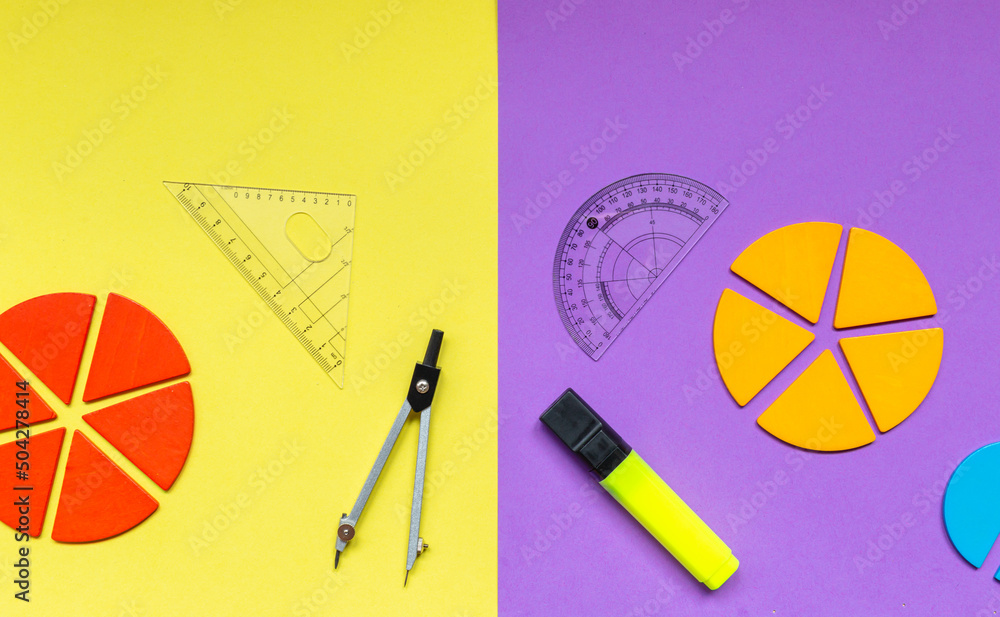 Multicolored fractions, rulers, pencils on a yellow violet background. Interesting, fun math for kids. Education, back to school concept
