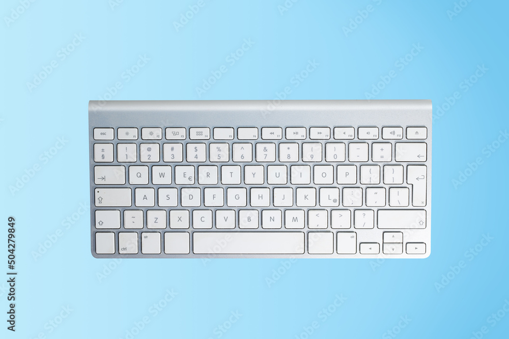 Computer keyboard on a colored background. Concept of typing, office work, remote work. Using your computer for work, play and online shopping. Computer keyboard on a colored background. Concept of typing, office work, remote work. Using your computer for work, play and online shopping.