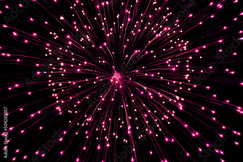 Close up photo of fireworks exploding in the night sky 