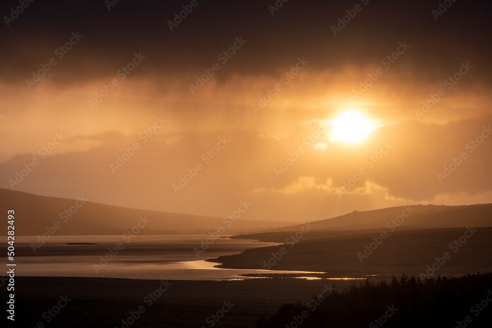 Bright sunset over Lough Carrowmore, County Mayo, Ireland