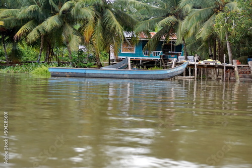 Boat moored in front of a house in the wetland outside of San Lorenzo, Ecuador