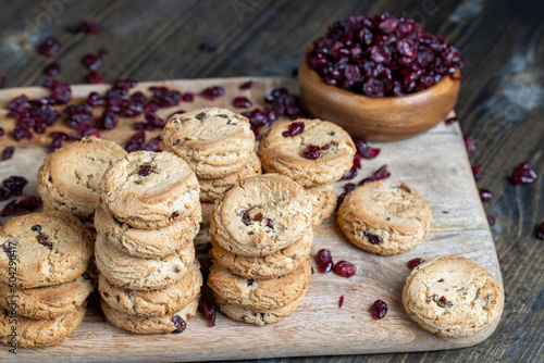 delicious dried cookies made of high-quality flour with dried red cranberries on the table