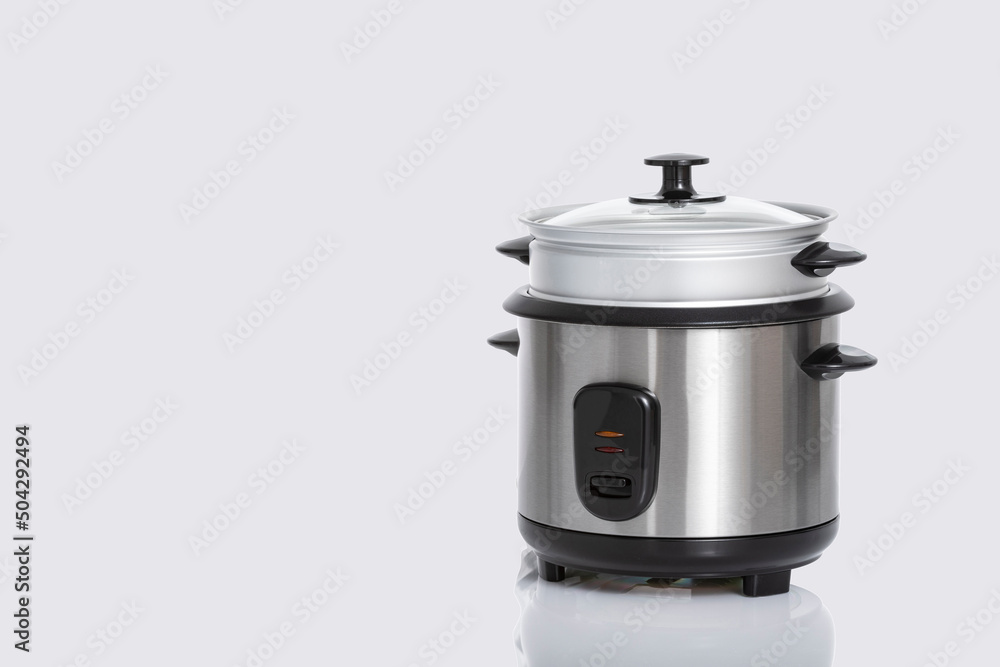 An Automatic Electric Rice Cooker Isolated On Gray Background An Automatic Electric Rice Cooker Isolated On Gray Background
