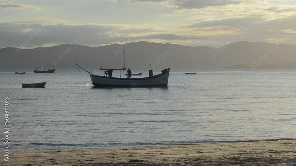 fishing boats at sunset on the sea fishing boats at sunset on the sea