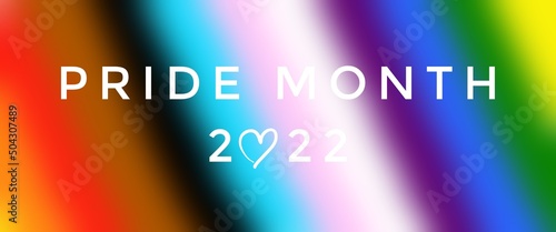 Texts 'PRIDE MONTH 2022', on blurred lgbtq+ flags background, concept for lgbtq+ community celebrations in pride month, june, 2022.