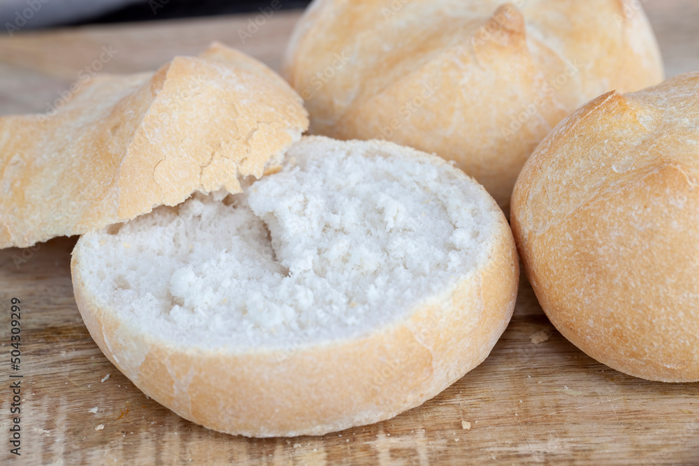 sliced into pieces with a knife fresh soft bun sliced into pieces with a knife fresh soft bun