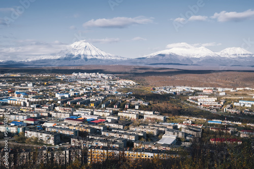 Capital of Kamchatka Petropavlovsk-Kamchatsky city view with volcano peaks on the horizon